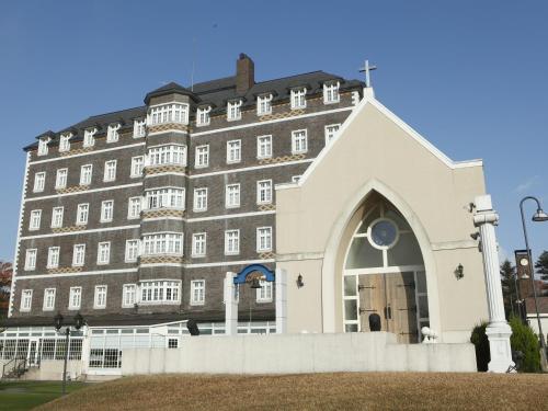 a building with a church in front of it at Wellness Forest Nasu in Nasu