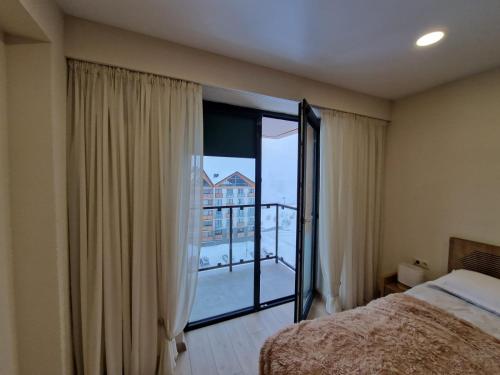 Postel nebo postele na pokoji v ubytování Cozy House New Gudauri