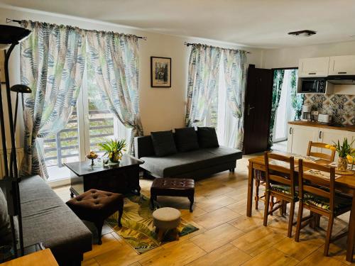 a living room with a couch and a table at Na Stoku in Świeradów-Zdrój