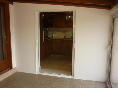 an open door to a kitchen in a room at Villa du soleil levant in Apt