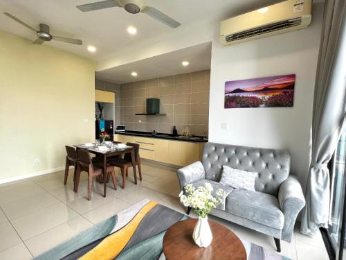 a living room with a couch and a table at D'pristine by Antlerzone in Johor Bahru