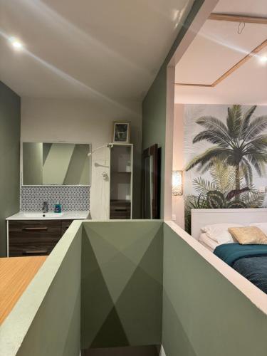 a bedroom with green and white walls and a bed at Logement de Ville 4 chambres proche de Lille in Tourcoing