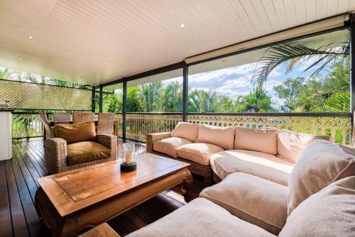 a living room with couches and a table at Comfy Character QLD’r ~ 3Bed Self-Contained-Upstairs House w/Parking ~ Woolloongabba in Brisbane