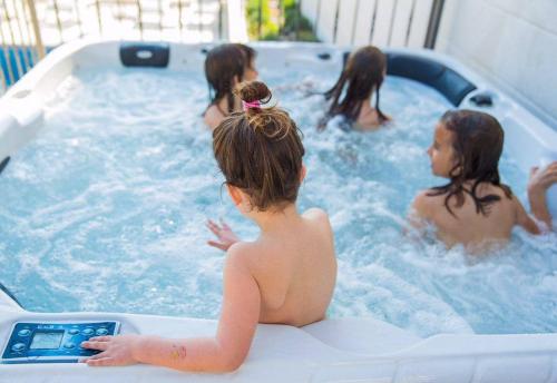 a group of girls in a jacuzzi tub at Apartments Villa Lukas in Cavtat