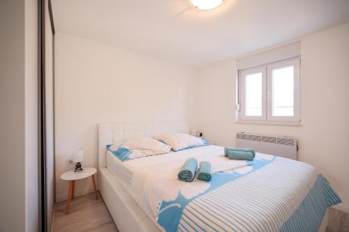 Ένα ή περισσότερα κρεβάτια σε δωμάτιο στο Apartment Munich Sabunike