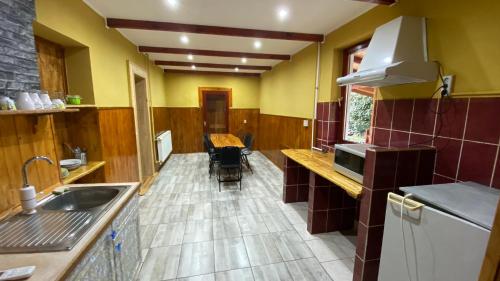 a kitchen with a sink and a counter top at Dobó Tanya in Röszke