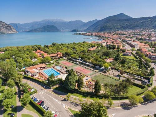 an aerial view of a resort with a lake at Estivo Premium Deluxe mobile homes on Camping Del Sole Village in Iseo