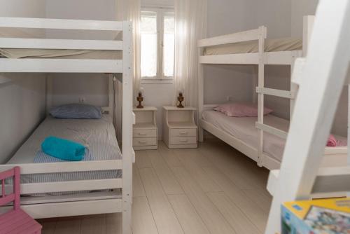 Кровать или кровати в номере VILLA BLEFOUTI at BLEFOUTI BEACH