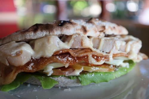 a sandwich sitting on top of a plate at Ziggy Stardust in Ko Phayam