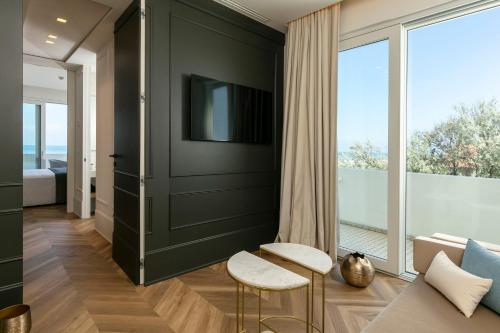 TV a/nebo společenská místnost v ubytování Hotel Abner's