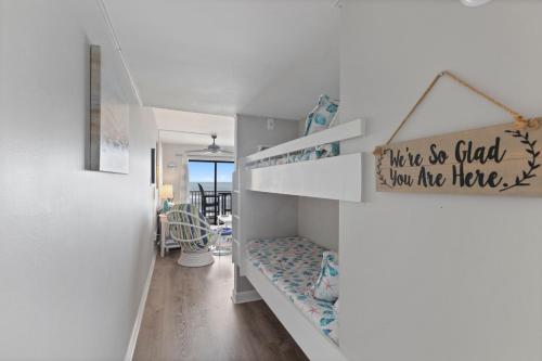 a white room with a shelf with a bench at Beachfront, Updated, Topsail Dunes Shining Sea in North Topsail Beach