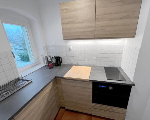 a kitchen with a stove and a counter top at Wohnung in Radebeul in Radebeul