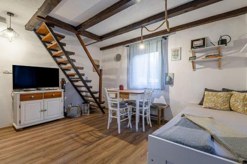 a living room with a couch and a table at Alpine House Naturalina - Happy Rentals in Slappe dʼIdria
