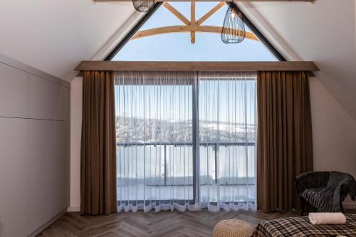 a large room with a large window with a view at Domki przy Szlaku Pod Gubałówką in Zakopane