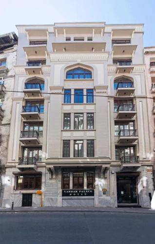 a large white building with many windows on a street at Vardar Palace Hotel - Special Category in Istanbul
