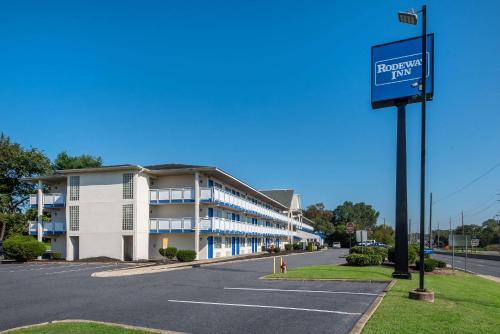 an empty parking lot in front of a building at Rodeway Inn in Brooklawn
