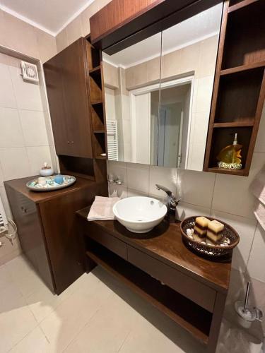 a bathroom with a sink and a mirror at Villa Seaview in Pteleós