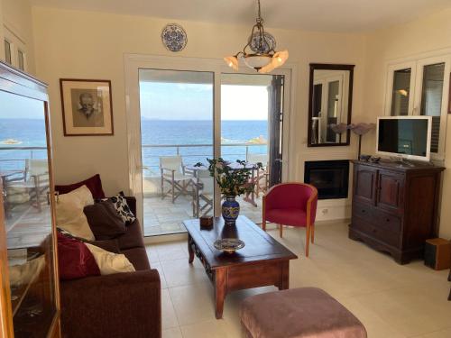a living room with a view of the ocean at Villa Seaview in Pteleós