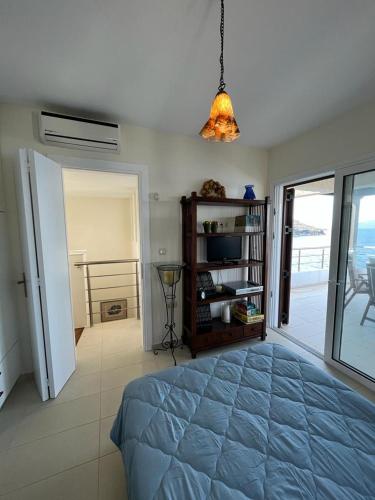 a bedroom with a bed and a view of the ocean at Villa Seaview in Pteleós