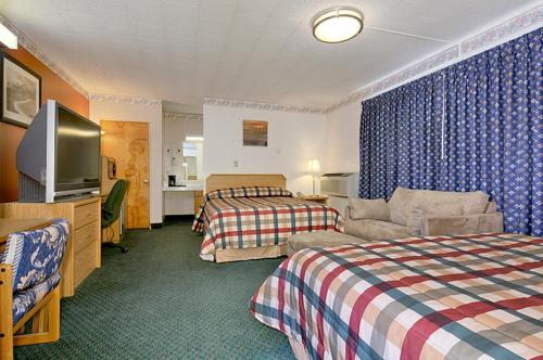 Postel nebo postele na pokoji v ubytování Townhouse Motel
