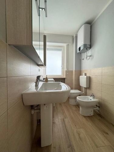a bathroom with a sink and a toilet at Apartment NicoCeli in Châtillon
