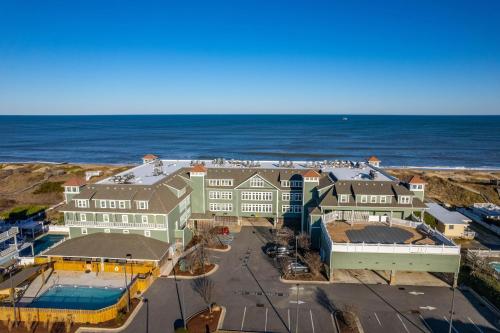 an aerial view of a hotel and the ocean at FF215 First Flight Retreat 215 in Kill Devil Hills