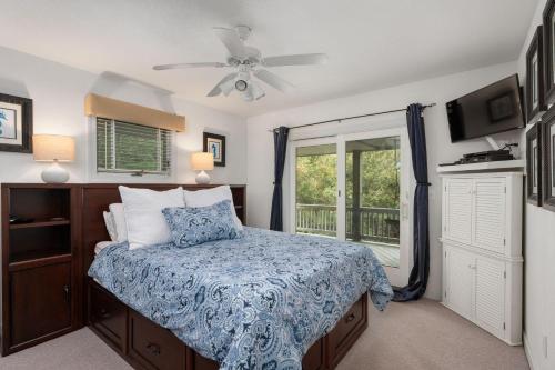 a bedroom with a bed and a window at SH157 Chase-n-Grace in Southern Shores