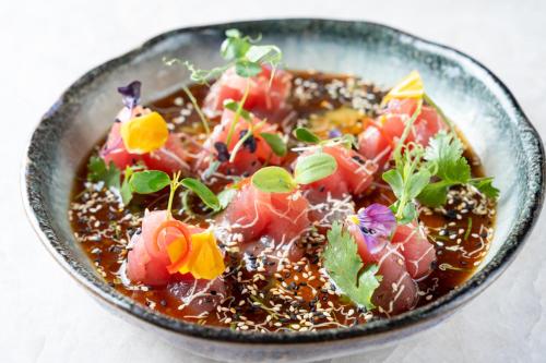 a bowl of food with vegetables in it at La Mansion Vi Vadi Hotel in Munich