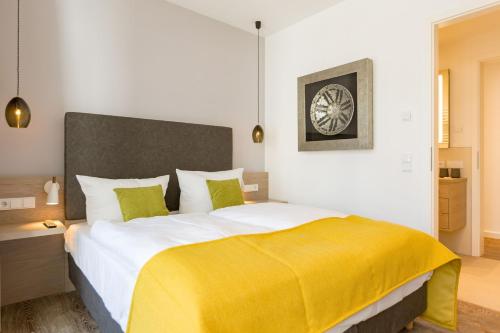 Postel nebo postele na pokoji v ubytování Beachhouse Bansin App 05