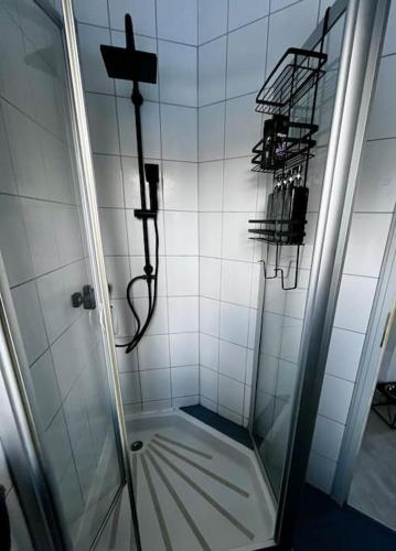a bathroom with a shower with a glass door at Bahnwärterhäuschen - 1873 in Feucht
