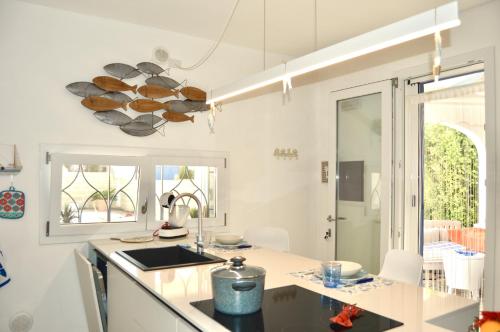 Kuchyň nebo kuchyňský kout v ubytování L' Alba del Salento