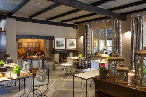 a rendering of a restaurant with tables and chairs at La Meridiana ReIais & Chateaux in Garlenda