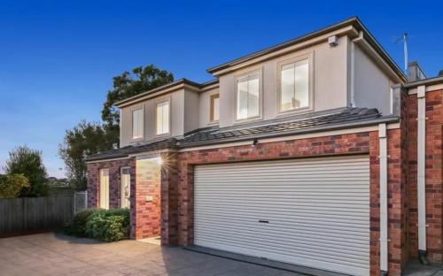 a red brick house with a garage at Tranquil Escape by Ready Set Stay in Dromana