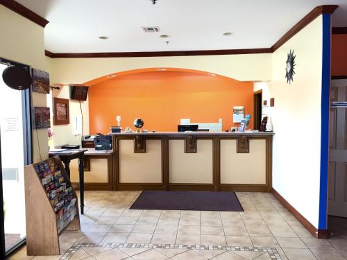 an entrance to a waiting room with a counter at Boca Chica Inn and Suites in Brownsville