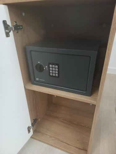 a microwave oven in a drawer of a cabinet at Best Experience Tours Centre in Tours