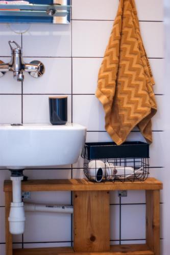 a bathroom with a sink and a towel at Domki na Widoku in Lubomierz