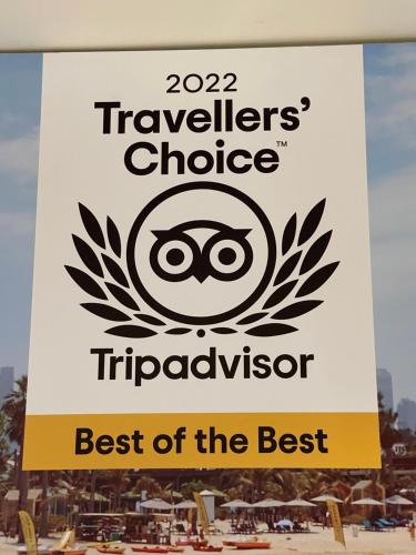 a sign for the travellers choice tripperposium at Suburban Studios by Choice Hotels- All American Staff - Ultra Sparkling - In-Room Kitchens - Sparkling Rooms - I-95 - Exit 36 - Special Rates - Smoking and Non Smoking Rooms - Stay & Save Today in Brunswick
