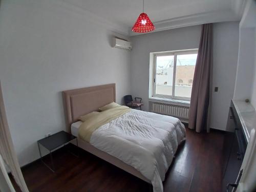 Postel nebo postele na pokoji v ubytování Sunny Inn Les berges du lac 1