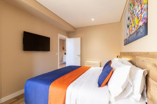 Una cama o camas en una habitación de CONDE13 Aparthotel