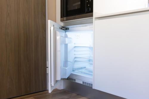 Una cama o camas en una habitación de CONDE13 Aparthotel