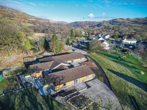 an aerial view of a house with a train tracks at Suite 1 - Sleeping Giant Hotel - Pen Y Cae Inn in Brecon