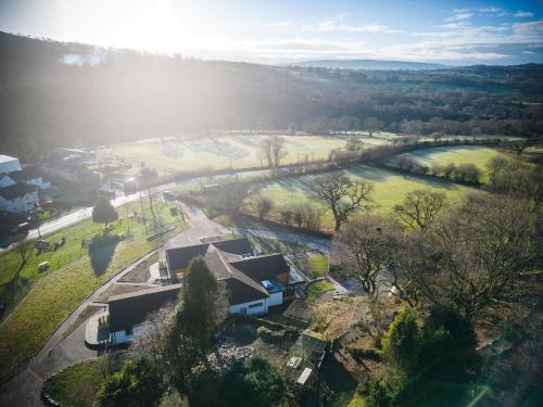 an aerial view of a house and a park at Suite 1 - Sleeping Giant Hotel - Pen Y Cae Inn in Brecon