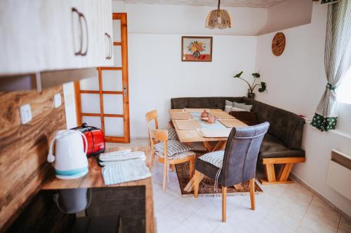 a living room with a table and a couch at Lichkovská chalupa in Lichkov