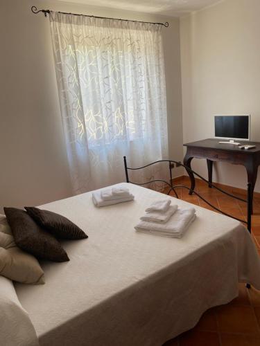 Postel nebo postele na pokoji v ubytování Baglio Quadrone Torre Salsa