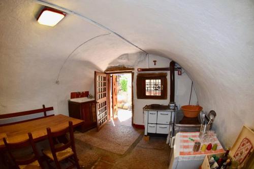 a kitchen with a table and a dining room at Casa Lia in Cascine