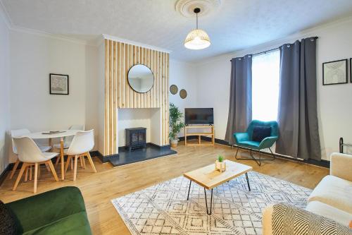 a living room with a couch and a table at Host & Stay - North Shore Cottage in Newbiggin-by-the-Sea