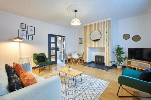 a living room with a couch and a table at Host & Stay - North Shore Cottage in Newbiggin-by-the-Sea