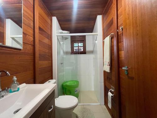 a bathroom with a shower and a toilet and a sink at Cabana Exclusiva: Recarregue suas Energias in Camboriú