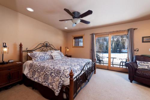 a bedroom with a bed and a ceiling fan at Black Bear 110 in Durango Mountain Resort