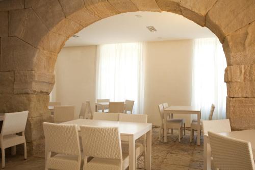 a dining room with a table and chairs in it at Boutique Isla Tabarca in Tabarca